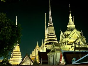 Wat Pho Temple beautifully illuminated at night in Bangkok, Thailand — a must-see landmark featured on Wandee Tours itineraries